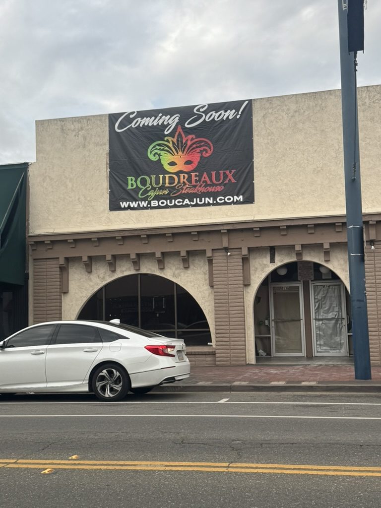 Boudreaux Cajun Steak House 'Coming Soon' banner on its storefront on Texas Street in downtown Fairfield