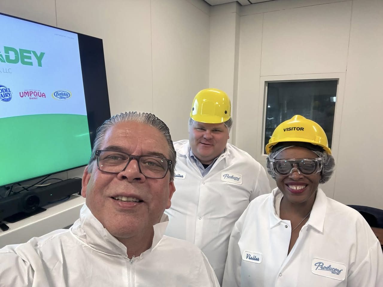 K. Patrice Williams and Councilmember Scott Tonnessen in visitor gear during a tour of Producers Dairy in Fairfield