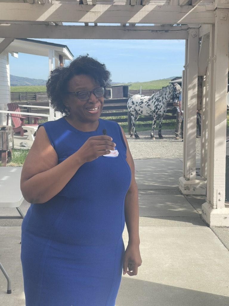 Councilwoman K. Patrice Williams at Rush Ranch, with draft horses and a wagon behind her